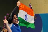 | Photo: AP/Manish Swarup : Manu Bhaker celebrates with the Indian flag